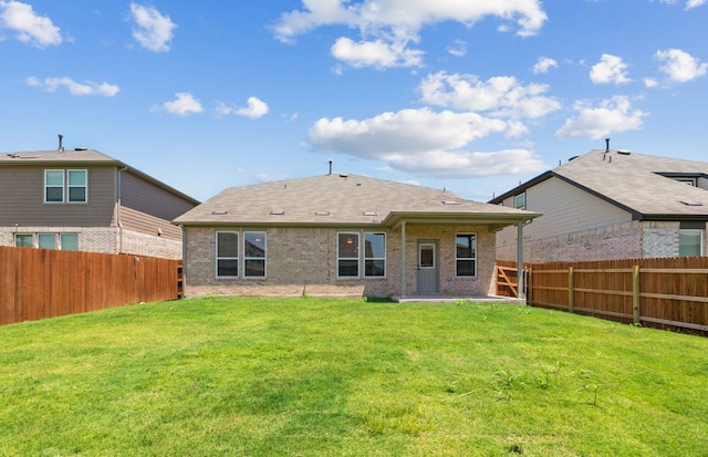 16804 Santiaguillo Trce, Manor, TX 78653 - rear view of property with a fenced backyard, brick siding, and a patio