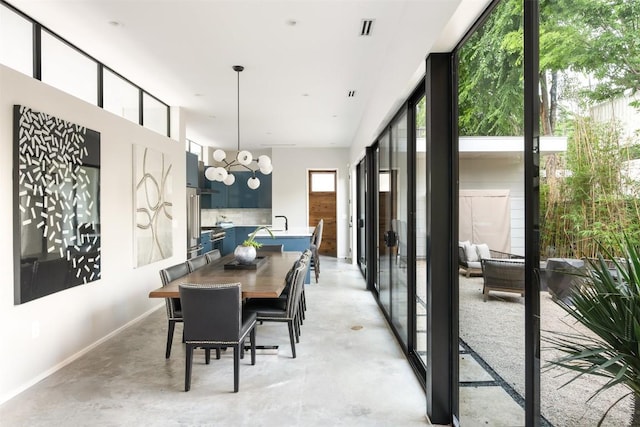 404 W Milton St, Austin, TX 78704 - dining room with concrete floors and baseboards