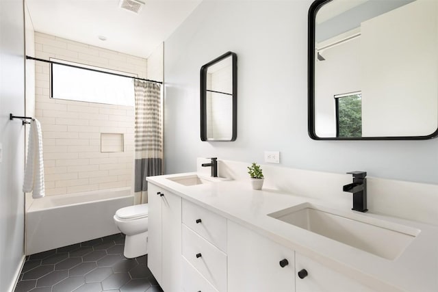 404 W Milton St, Austin, TX 78704 - bathroom with plenty of natural light, toilet, tile patterned flooring, and double vanity