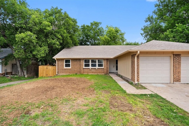 1800 Nicole Cir, Round Rock, TX 78664 - view of front of property featuring a garage, brick siding, driveway, and a shingled roof