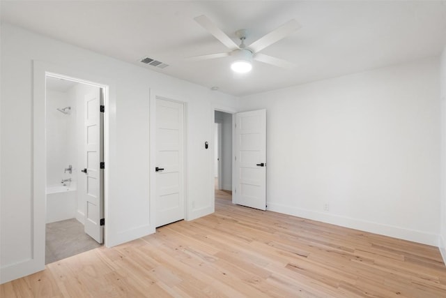 1800 Nicole Cir, Round Rock, TX 78664 - unfurnished bedroom with light wood-style flooring, baseboards, ensuite bathroom, and ceiling fan
