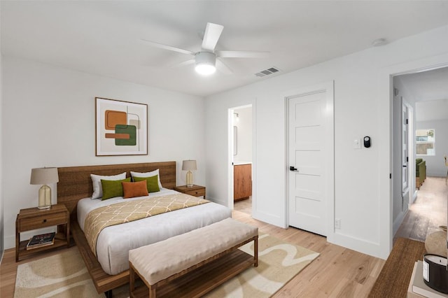 1800 Nicole Cir, Round Rock, TX 78664 - bedroom with light wood finished floors, baseboards, ensuite bathroom, and ceiling fan