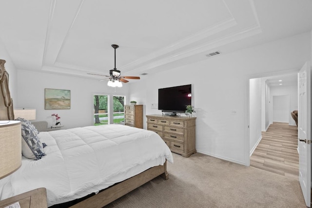 906 Texas Trl, Austin, TX 78737 - bedroom featuring a tray ceiling, a ceiling fan, baseboards, light carpet, and crown molding