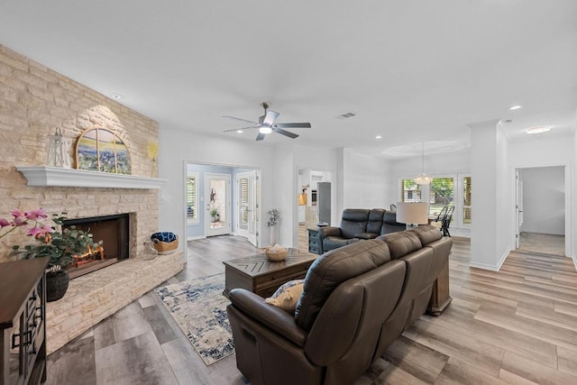 906 Texas Trl, Austin, TX 78737 - living area with a ceiling fan, recessed lighting, a fireplace, wood finished floors, and baseboards