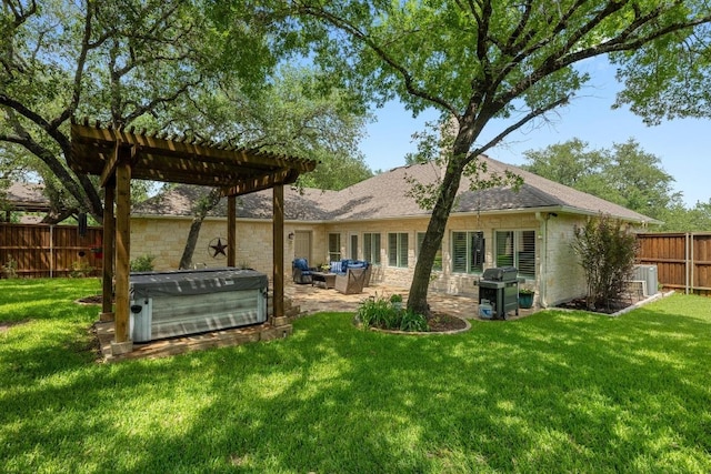 906 Texas Trl, Austin, TX 78737 - rear view of property with a hot tub, a patio area, a pergola, stone siding, and roof with shingles