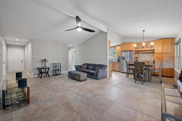 11707 Ruffed Grouse Dr, Austin, TX 78758 - living area featuring lofted ceiling, a textured ceiling, ceiling fan, a chandelier, and light tile patterned floors