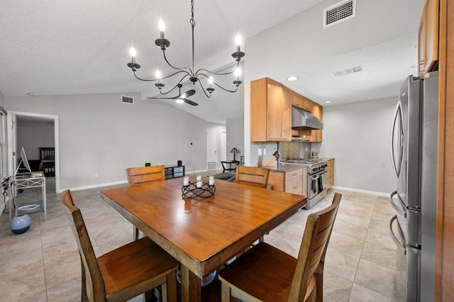 11707 Ruffed Grouse Dr, Austin, TX 78758 - dining room featuring lofted ceiling, a chandelier, light tile patterned flooring, and a textured ceiling