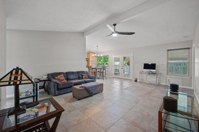 11707 Ruffed Grouse Dr, Austin, TX 78758 - living area with a ceiling fan, french doors, a textured ceiling, a chandelier, and light tile patterned floors