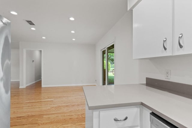kitchen with white cabinetry, recessed lighting, dishwashing machine, light countertops, and light wood finished floors