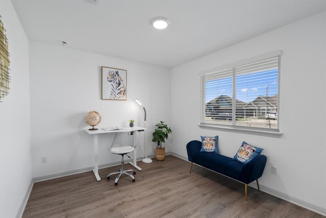 office space featuring wood finished floors and baseboards
