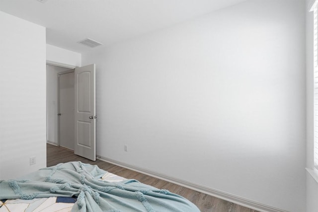 bedroom with wood finished floors
