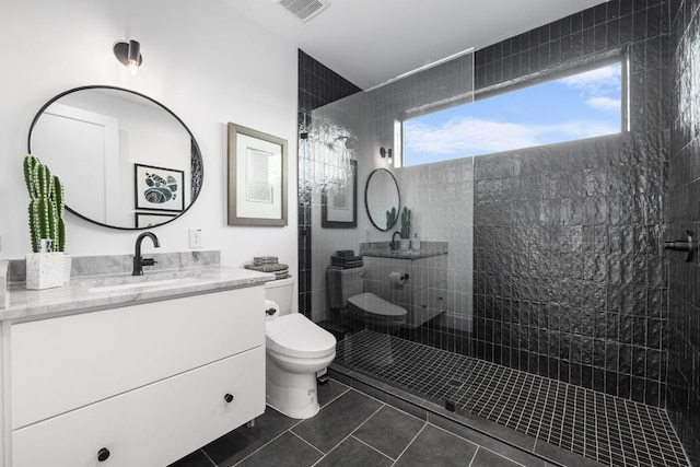 2800 Del Curto Rd Unit 9, Austin, TX 78704 - bathroom with vanity, walk in shower, and tile patterned flooring