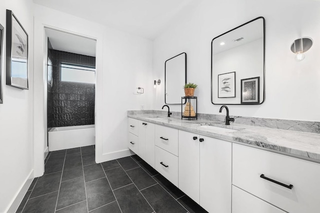 2800 Del Curto Rd Unit 9, Austin, TX 78704 - bathroom featuring double vanity, shower / bath combination, baseboards, and tile patterned floors