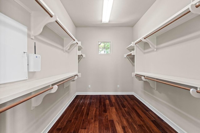 8293 Lime Creek Rd, Volente, TX 78641 - walk in closet featuring dark wood-style floors
