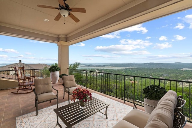 balcony featuring ceiling fan and an outdoor hangout area