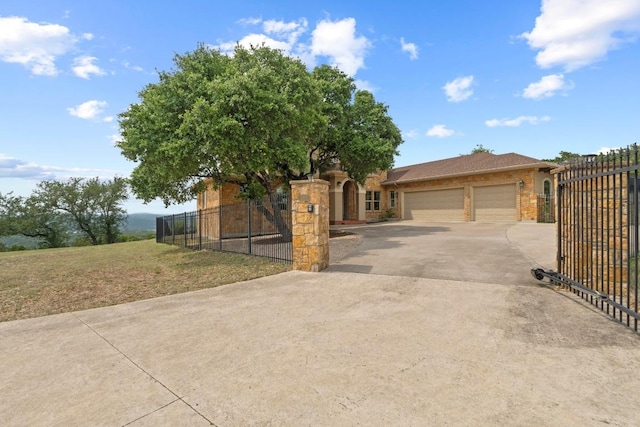 8293 Lime Creek Rd, Volente, TX 78641 - view of front of house featuring driveway, a garage, and a gate