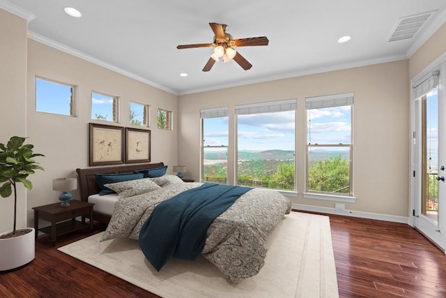 bedroom with wood finished floors, recessed lighting, crown molding, ceiling fan, and baseboards
