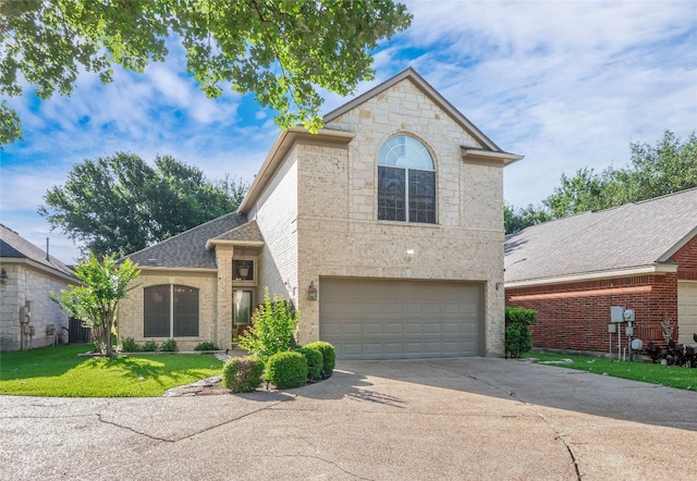 11029 Ballybunion Pl, Austin, TX 78747 - view of front of home featuring concrete driveway, a garage, a front lawn, and roof with shingles