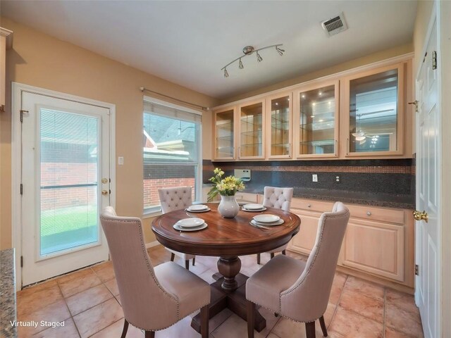 11029 Ballybunion Pl, Austin, TX 78747 - dining room featuring light tile patterned floors