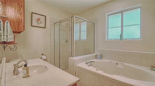 full bath with a stall shower, a bath, and vanity