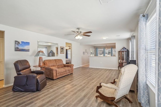 210 Salt Creek Ln, Georgetown, TX 78633 - living room featuring ceiling fan, wood finished floors, and baseboards