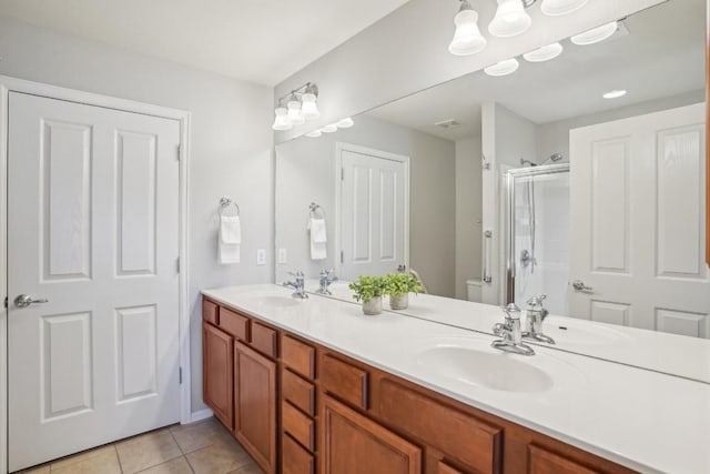 210 Salt Creek Ln, Georgetown, TX 78633 - full bathroom featuring a shower stall, toilet, double vanity, and tile patterned floors