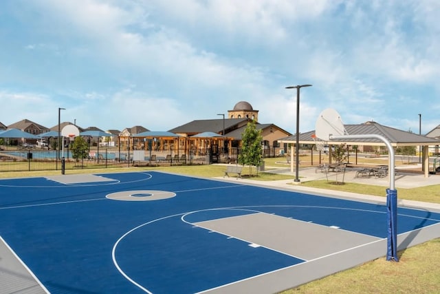 view of basketball court featuring fence, a gazebo, and community basketball court