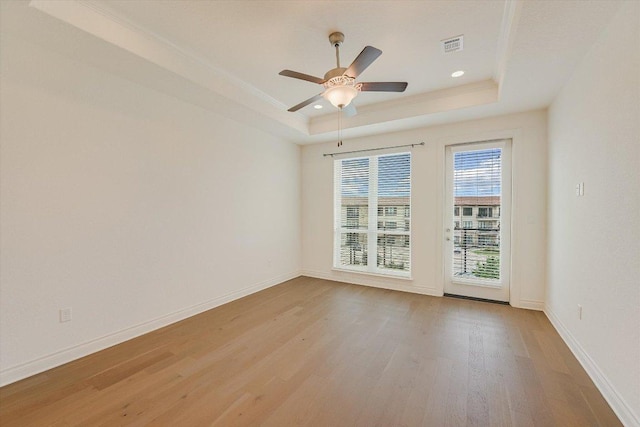 102 Bella Toscana Ave Unit 1306, Lakeway, TX 78734 - unfurnished room with a tray ceiling, light wood-type flooring, a ceiling fan, baseboards, and recessed lighting