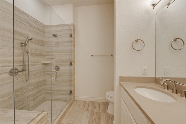 102 Bella Toscana Ave Unit 1306, Lakeway, TX 78734 - bathroom featuring a shower stall, toilet, and vanity