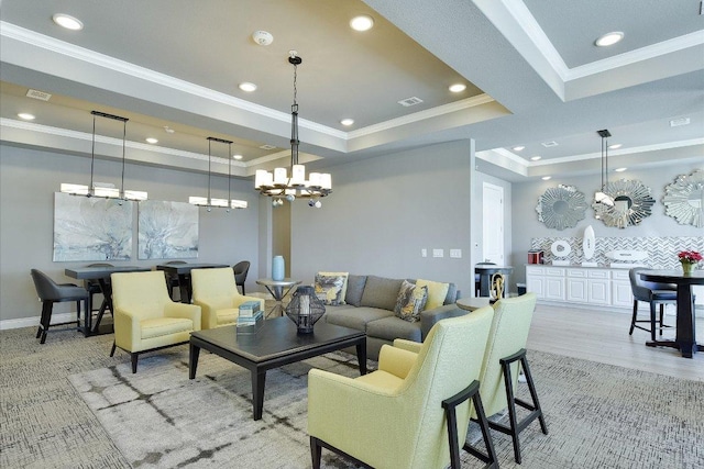 102 Bella Toscana Ave Unit 1306, Lakeway, TX 78734 - living area featuring a chandelier, recessed lighting, crown molding, a raised ceiling, and light wood-type flooring
