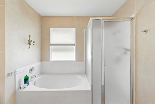2111 Marcus Abrams Blvd, Austin, TX 78748 - full bathroom featuring a shower stall and a garden tub
