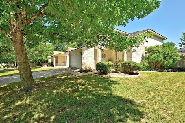 2111 Marcus Abrams Blvd, Austin, TX 78748 - view of front of house featuring concrete driveway, a garage, and stone siding
