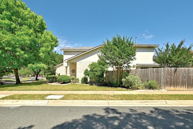 2111 Marcus Abrams Blvd, Austin, TX 78748 - view of side of property with stone siding and stucco siding