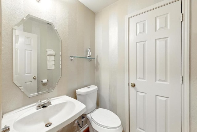 2111 Marcus Abrams Blvd, Austin, TX 78748 - half bathroom with a sink and toilet