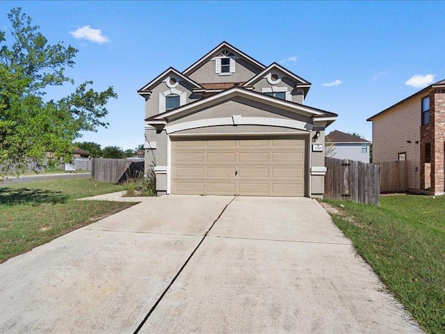 200 Karrie Dr, Kyle, TX 78640 - traditional-style house with concrete driveway and stucco siding