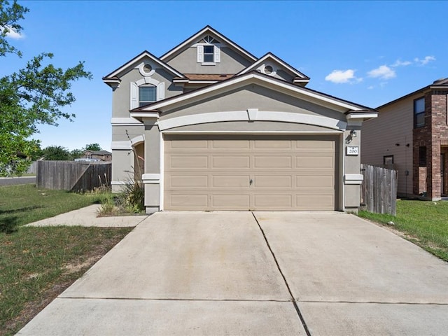 200 Karrie Dr, Kyle, TX 78640 - traditional-style home with stucco siding and driveway