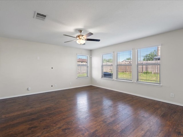 200 Karrie Dr, Kyle, TX 78640 - empty room with a ceiling fan and dark wood-style flooring