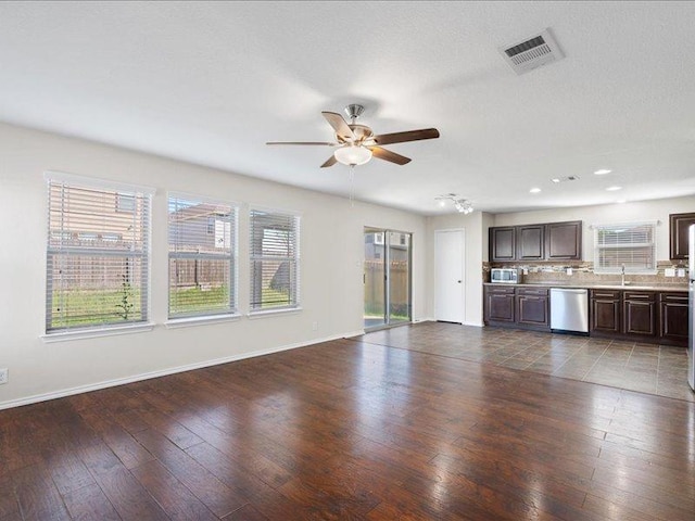 200 Karrie Dr, Kyle, TX 78640 - unfurnished living room with ceiling fan, dark wood-style flooring, and recessed lighting