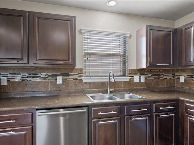 200 Karrie Dr, Kyle, TX 78640 - kitchen featuring dishwasher, dark brown cabinets, dark countertops, and tasteful backsplash