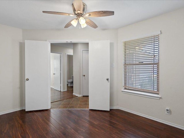 200 Karrie Dr, Kyle, TX 78640 - unfurnished bedroom featuring wood finished floors and ceiling fan