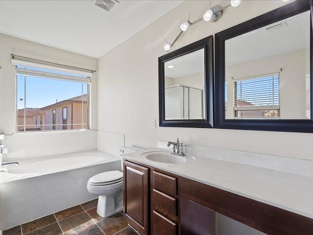 200 Karrie Dr, Kyle, TX 78640 - full bathroom featuring a garden tub, vanity, an enclosed shower, and stone finish flooring
