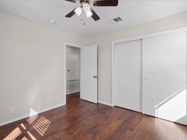 200 Karrie Dr, Kyle, TX 78640 - unfurnished bedroom featuring a closet, wood finished floors, and ceiling fan