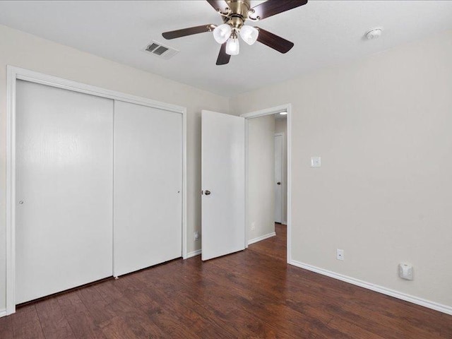 200 Karrie Dr, Kyle, TX 78640 - unfurnished bedroom with wood finished floors, a closet, and a ceiling fan