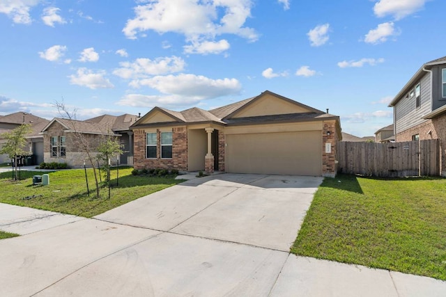 112 Montego St, Hutto, TX 78634 - ranch-style house featuring brick siding, an attached garage, and driveway