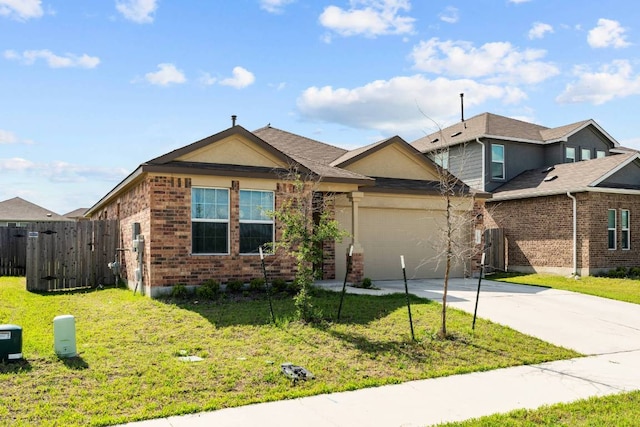 112 Montego St, Hutto, TX 78634 - view of front of property featuring brick siding, concrete driveway, and a garage