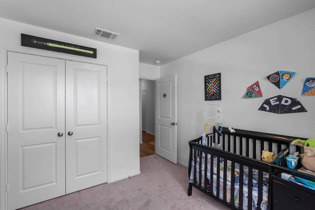 112 Montego St, Hutto, TX 78634 - carpeted bedroom with a closet and a crib