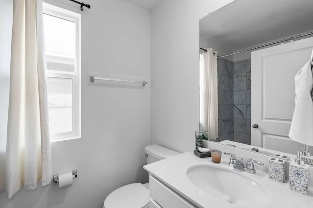 112 Montego St, Hutto, TX 78634 - bathroom with plenty of natural light, toilet, vanity, and curtained shower
