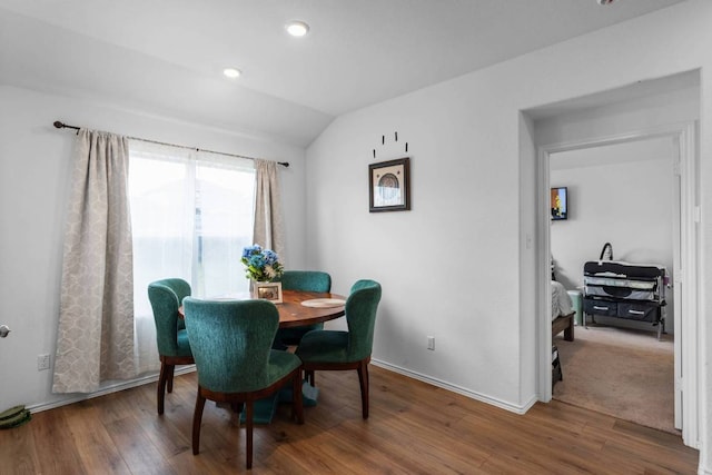 112 Montego St, Hutto, TX 78634 - dining space featuring wood finished floors, lofted ceiling, baseboards, and recessed lighting