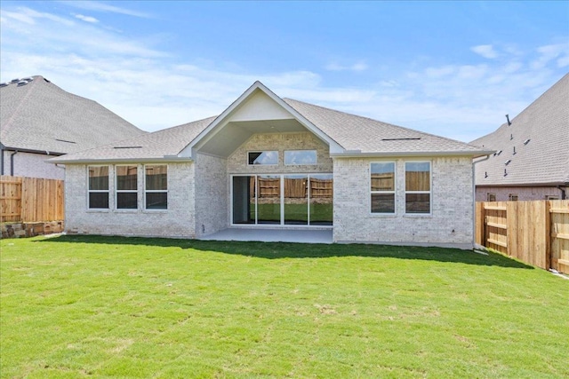145 Lost Tree Dr, Buda, TX 78610 - back of property featuring a patio and brick siding