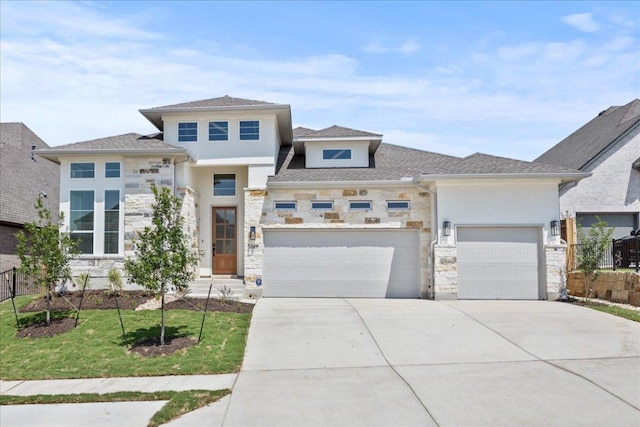 145 Lost Tree Dr, Buda, TX 78610 - prairie-style home featuring stone siding, a garage, driveway, and stucco siding